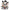 A white plush cat toy styled like a horror clown, wearing a black top hat, black-and-white striped outfit, and red buttons, with red scratch marks and one yellow and one red eye on a plain white background.