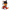 A plush toy cat character with black, orange, and white fur, wearing red overalls and holding a knife, photographed on a plain white background.