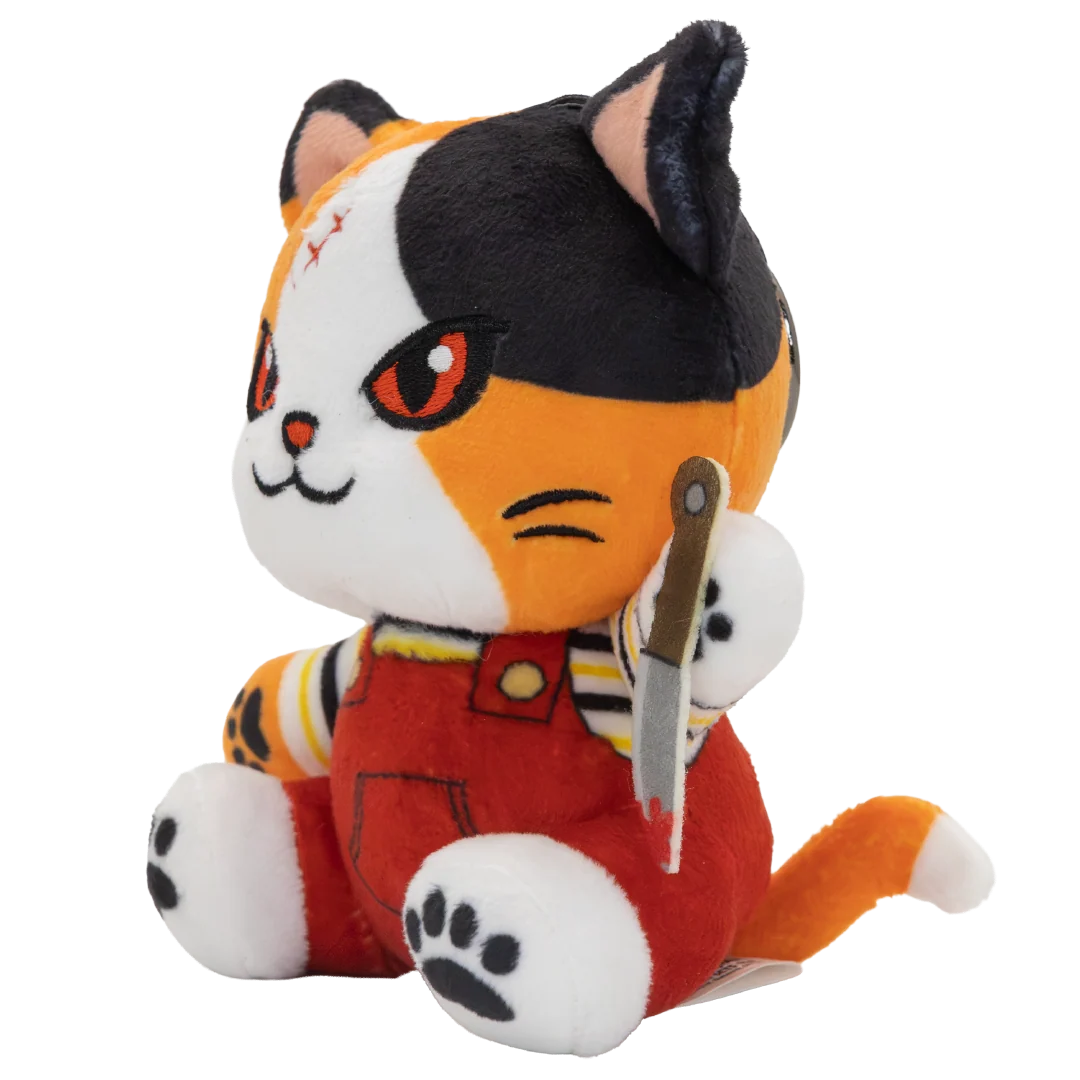 A plush toy cat character with black, orange, and white fur, wearing red overalls and holding a knife, photographed on a plain white background.
