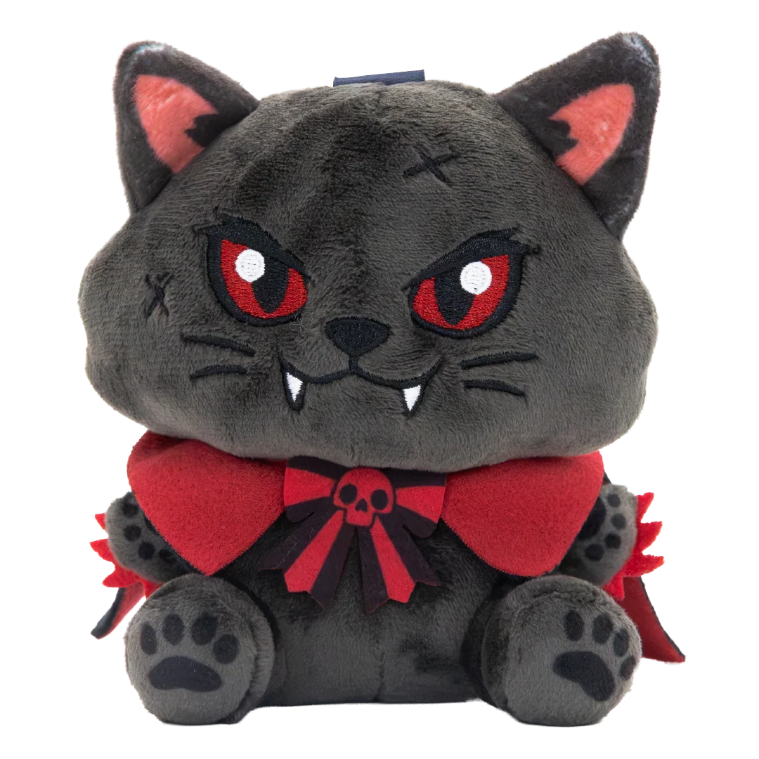 A plush toy of a cute, dark gray vampire cat with red eyes, a red cape, and a red bow tie with a small skull emblem, set against a plain white background.