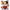 A plush toy of a horror character cat resembling Chucky, with orange, black, and white fur, red overalls, and holding a bloody knife, isolated on a white background.
