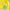Green dog-shaped keychain attached to a yellow textured bag