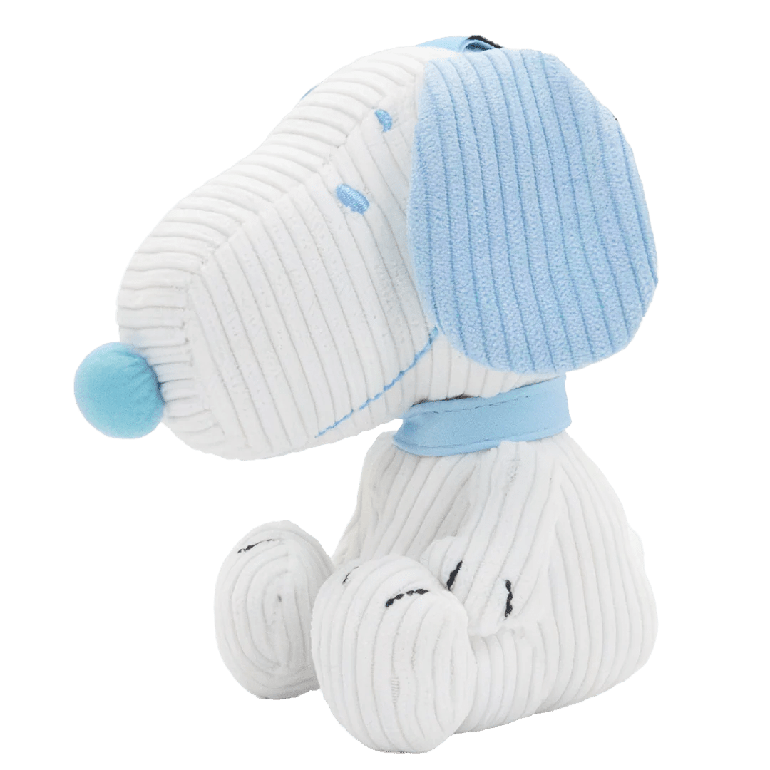 White plush dog toy with blue accents on a white background