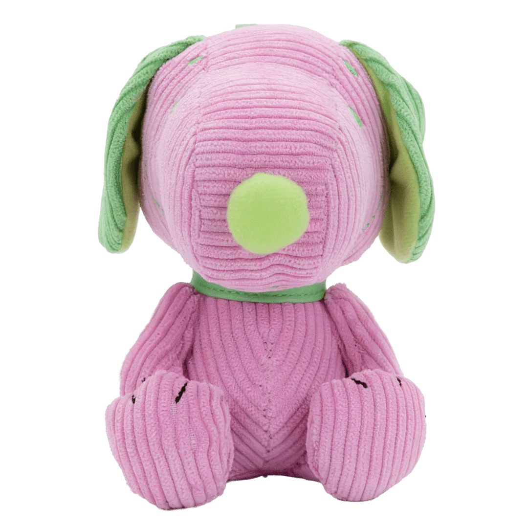 Pink plush dog toy with green accents on a white background