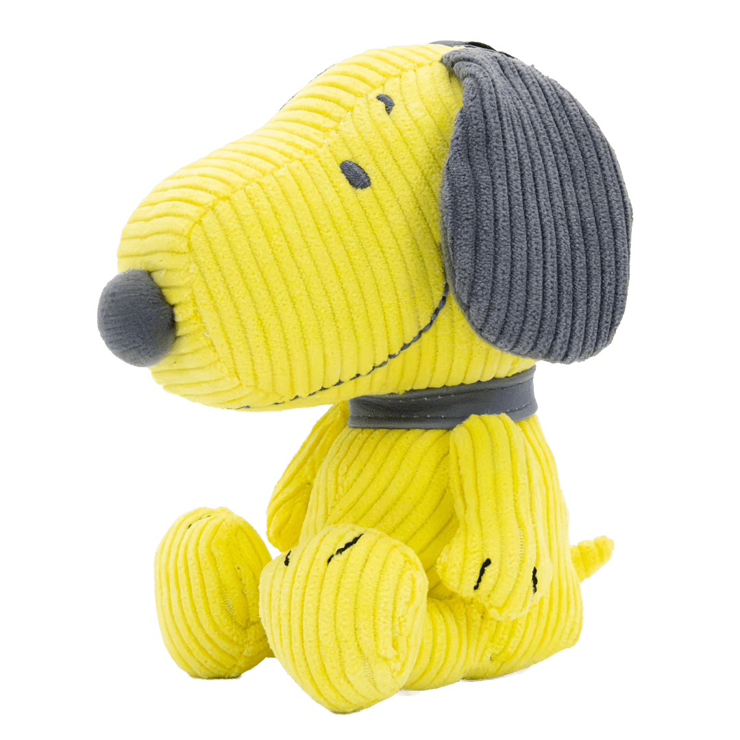 Yellow plush dog toy with gray ears on a white background