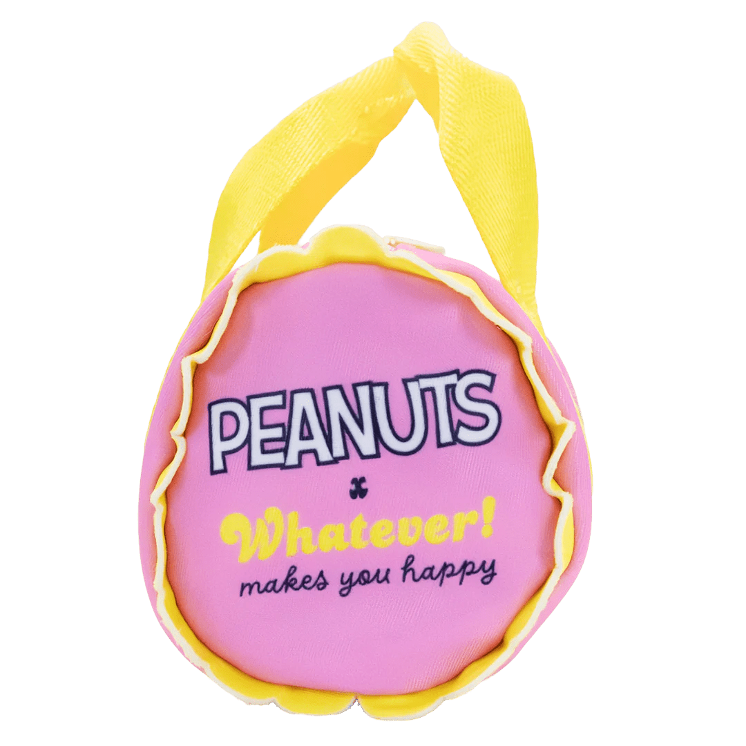 Pink plush bag with yellow trim and 'Peanuts Whatever makes you happy' text on a white background