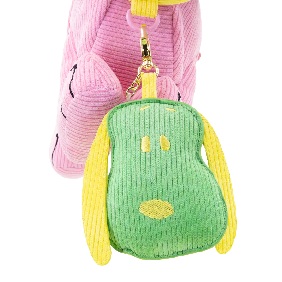 Green and yellow plush keychain with a smiley face on a white background
