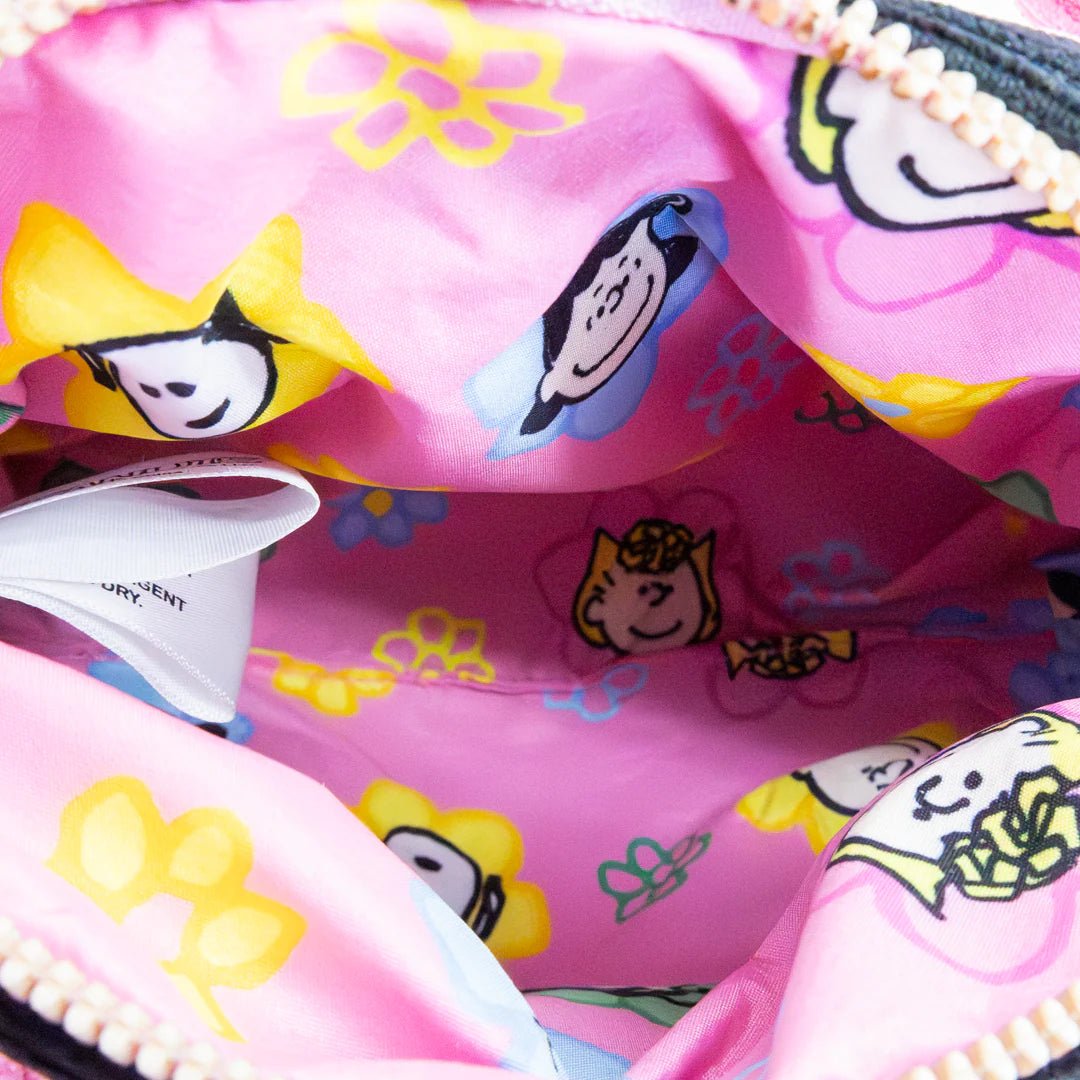 Close-up of a pink bag with cartoon character designs on a white background