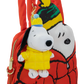 A red Snoopy-themed shoulder bag featuring a plush Snoopy character charm wearing a yellow jacket and blue-and-yellow beanie, shown against a plain white background.