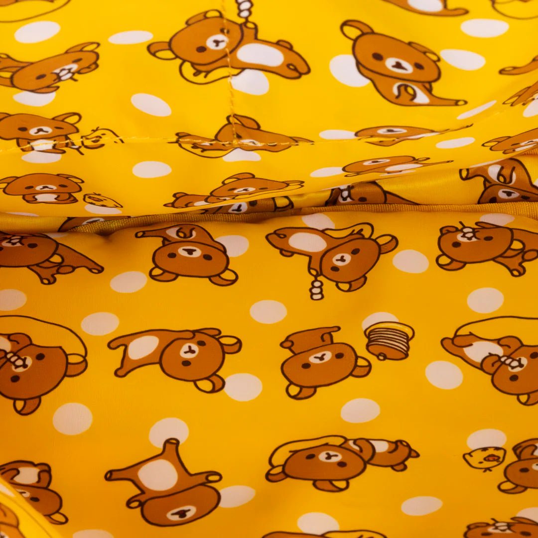 Pattern of cartoon bears on a yellow background with white polka dots
