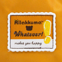 Patch with 'Rilakkuma Whatever! makes you happy' text on a yellow background