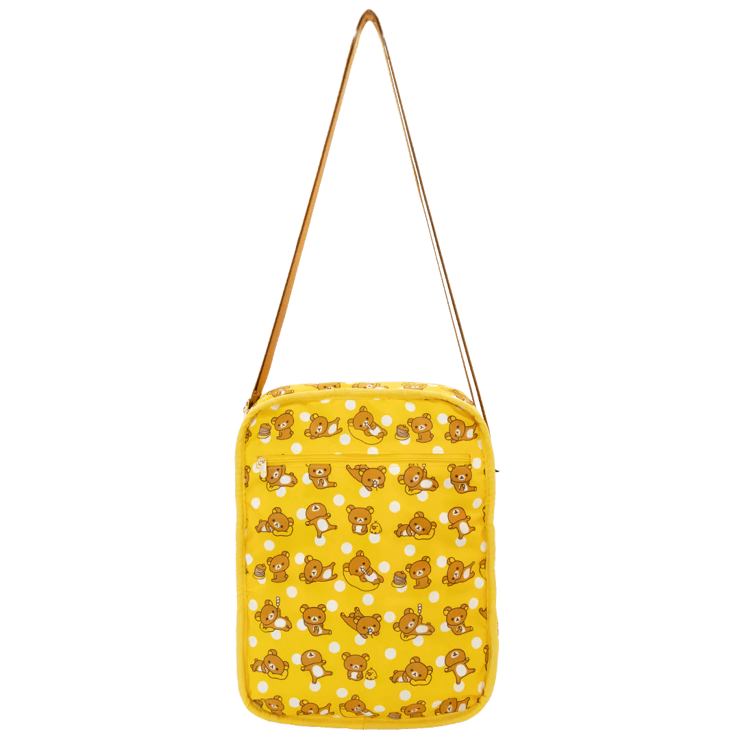 Yellow bag with teddy bear pattern on a white background