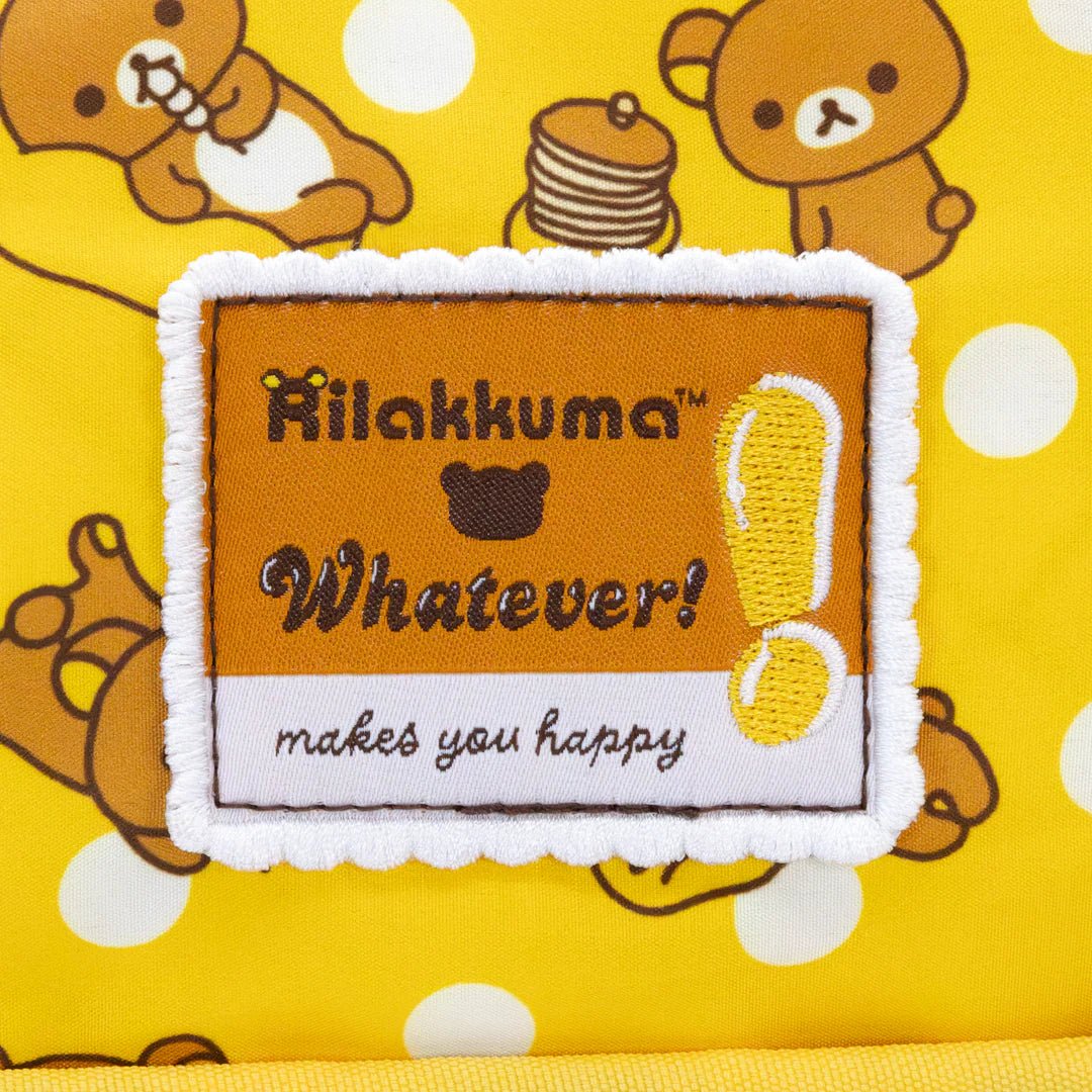 Patch with 'Rilakkuma Whatever! makes you happy' text on a yellow background with cartoon bears.
