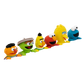 A set of six Sesame Street character toy figures lined up in a diagonal row against a plain white background. The characters include Ernie, Oscar, Bert, Elmo, Big Bird, and Cookie Monster.