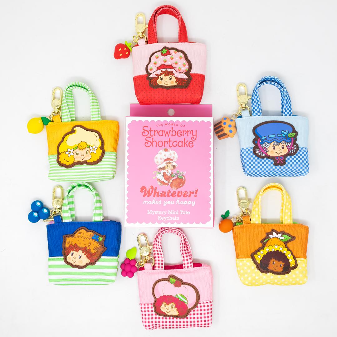 Mini canvas tote bag featuring Whatever Makes You Happy Strawberry Shortcake Besties blind box charm