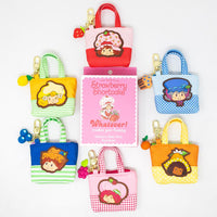 Mini canvas tote bag featuring Whatever Makes You Happy Strawberry Shortcake Besties blind box charm