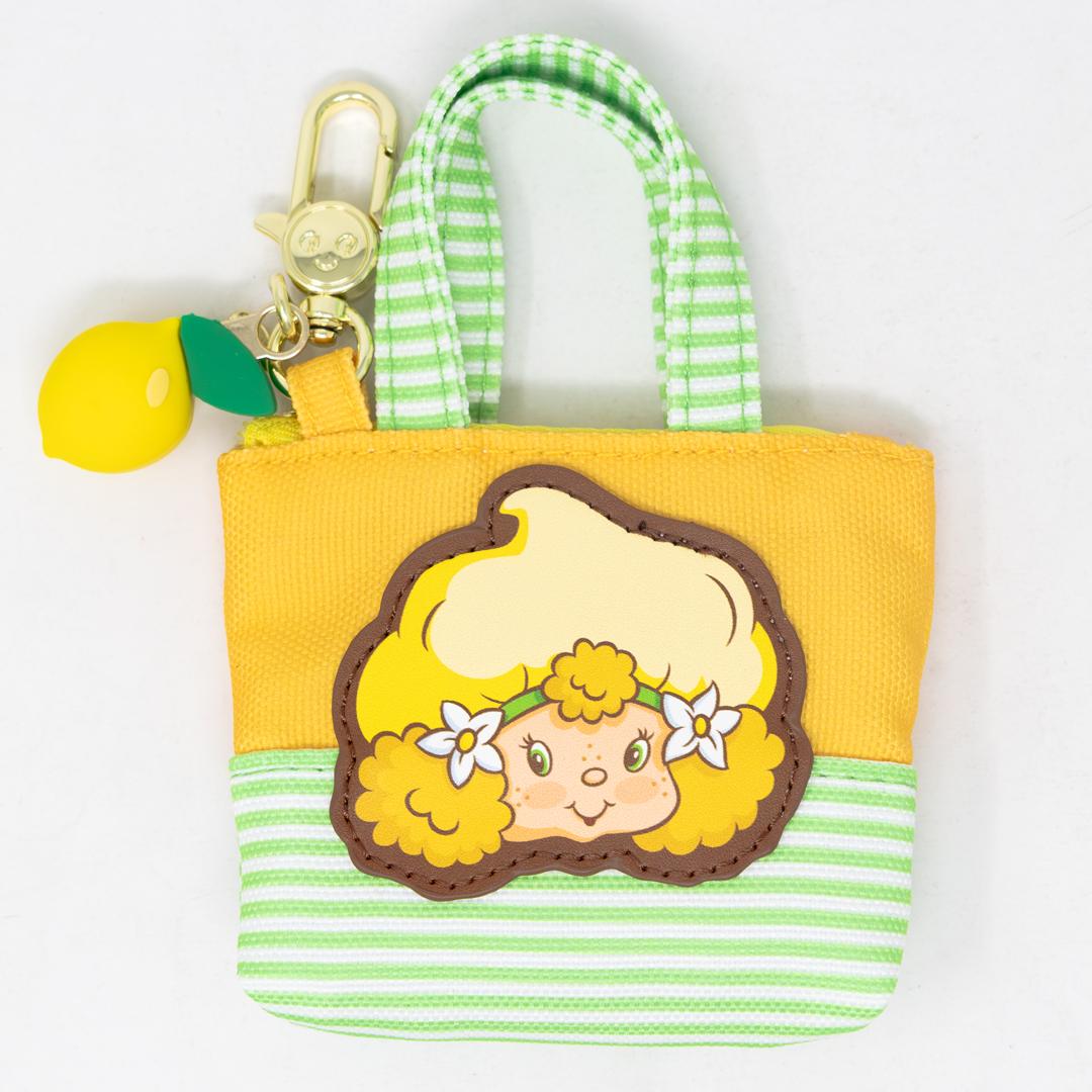 Small canvas tote bag with 1980s-inspired Strawberry Shortcake Besties charm