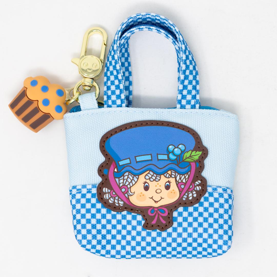 Collectible Strawberry Shortcake Besties mini tote featuring scented blind box charm