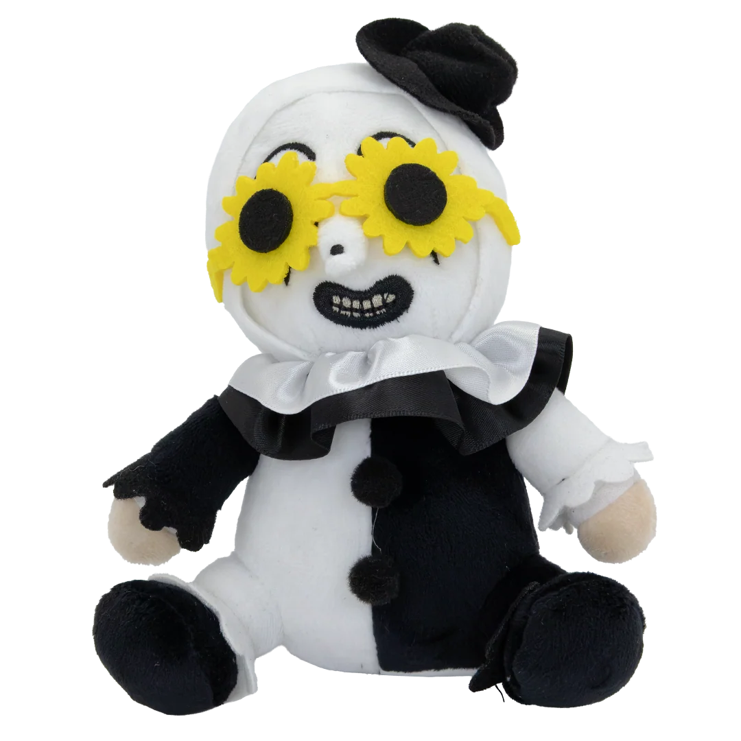 A plush doll toy with a split black-and-white body, yellow sunflower-style eyes, a black hat, and a white ruffled collar, photographed on a plain white background.