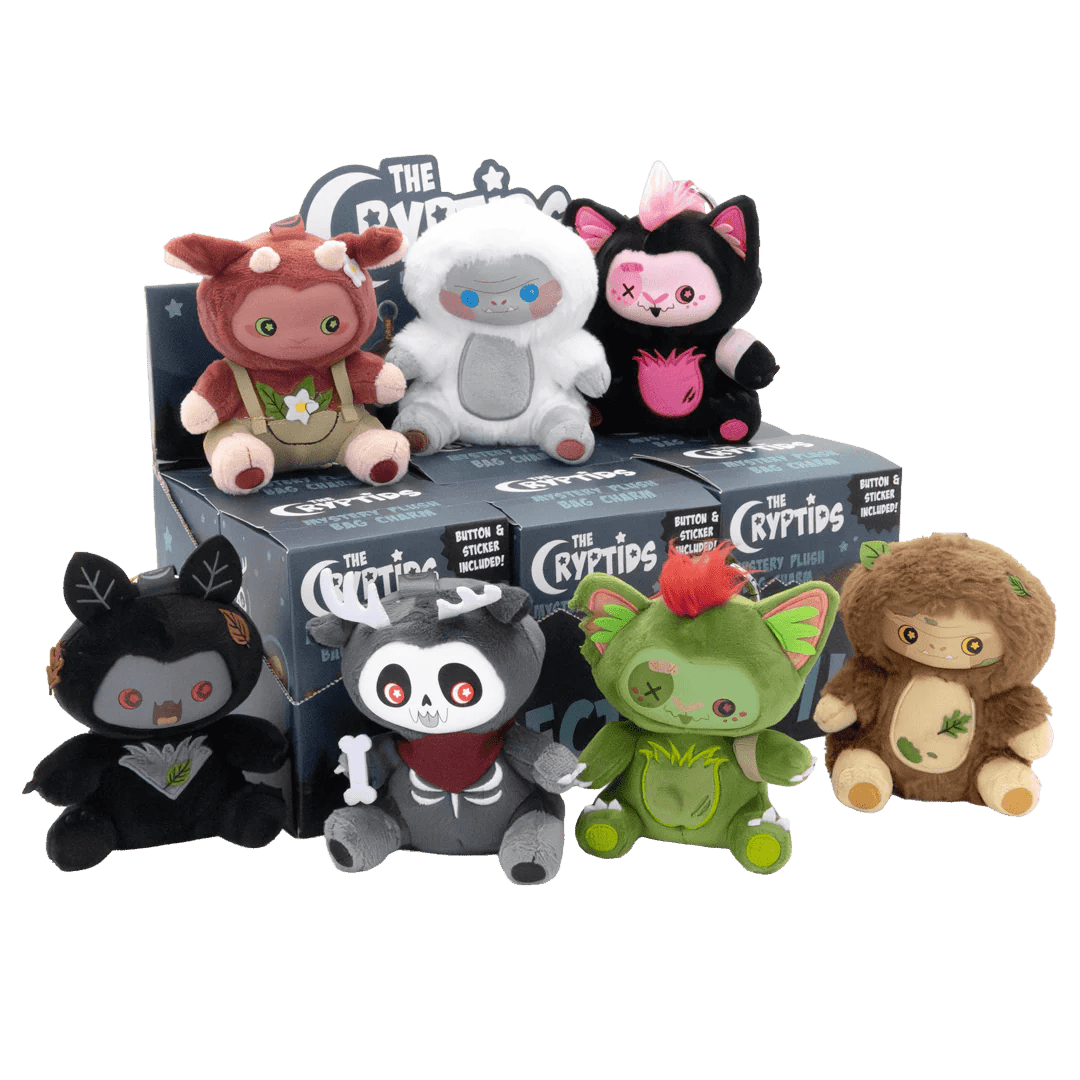Collection of Cryptid plush toys in front of their packaging on a white background
