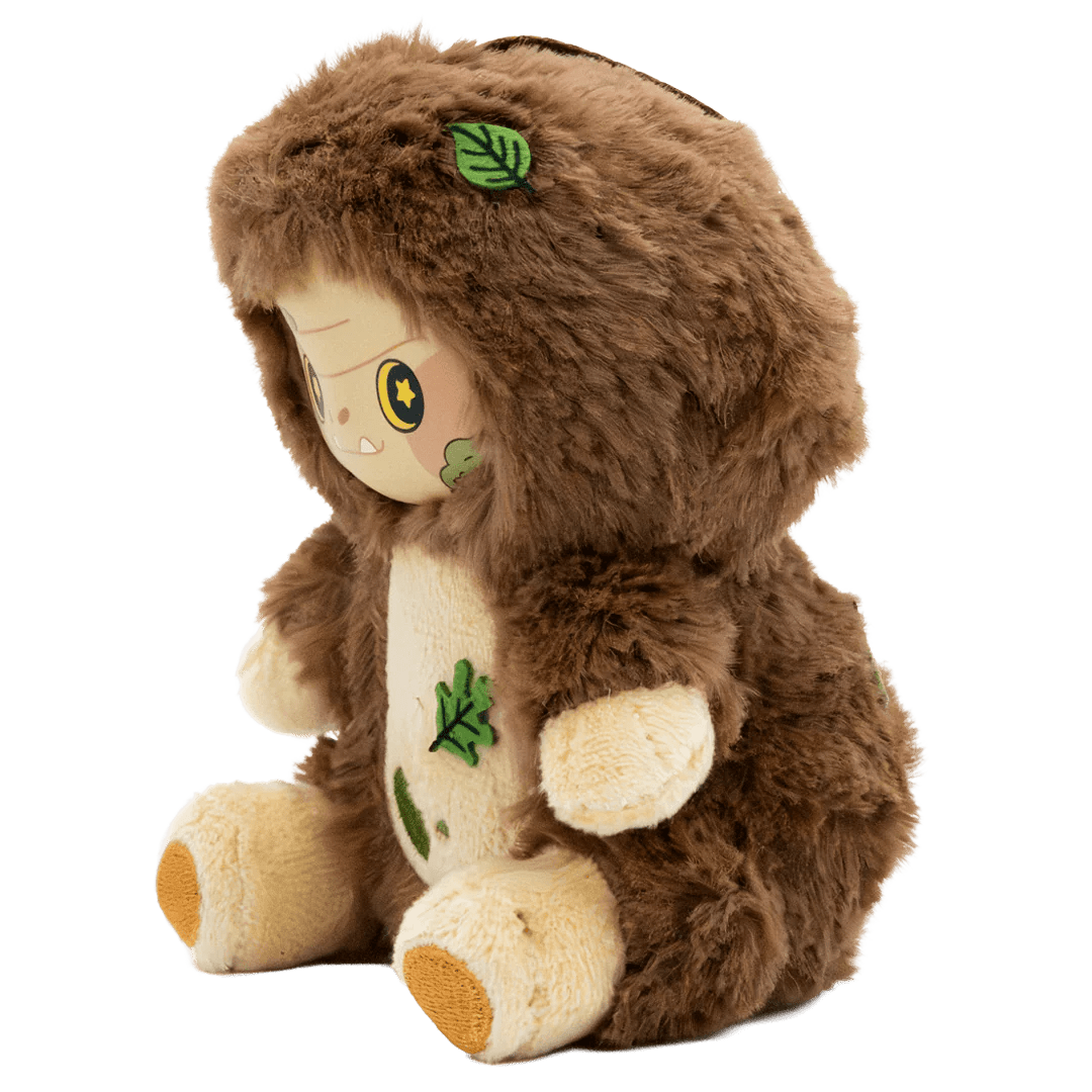 Plush toy with a brown hood and leaf designs on a white background