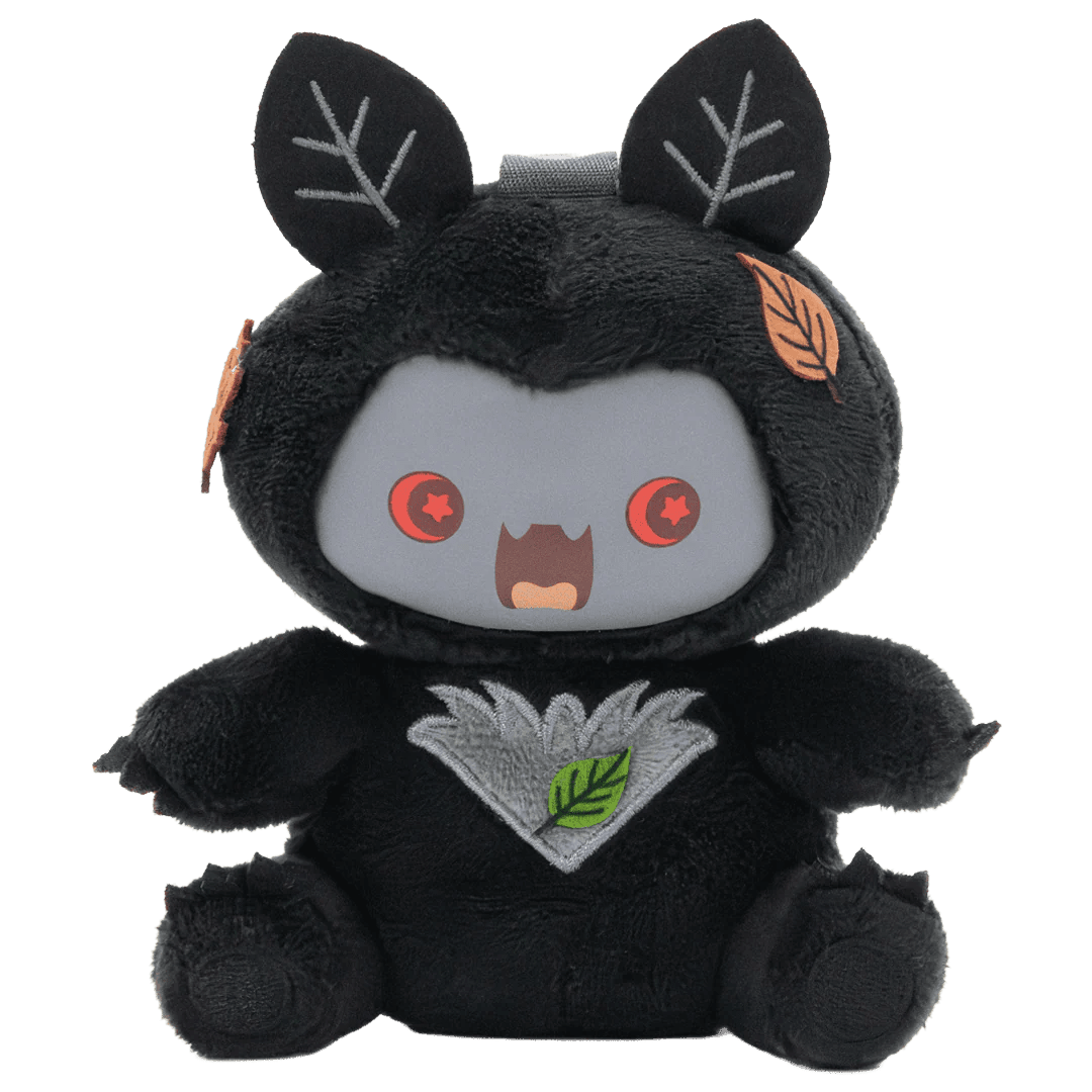 Black plush toy with leaf-like ears and a surprised expression on a white background
