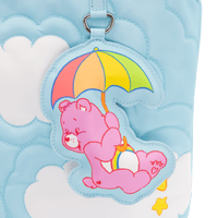 Pink bear with an umbrella on a blue cloud-patterned bag