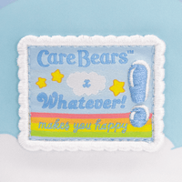 Care Bears patch with text 'Whatever! Makes you happy' on a blue background