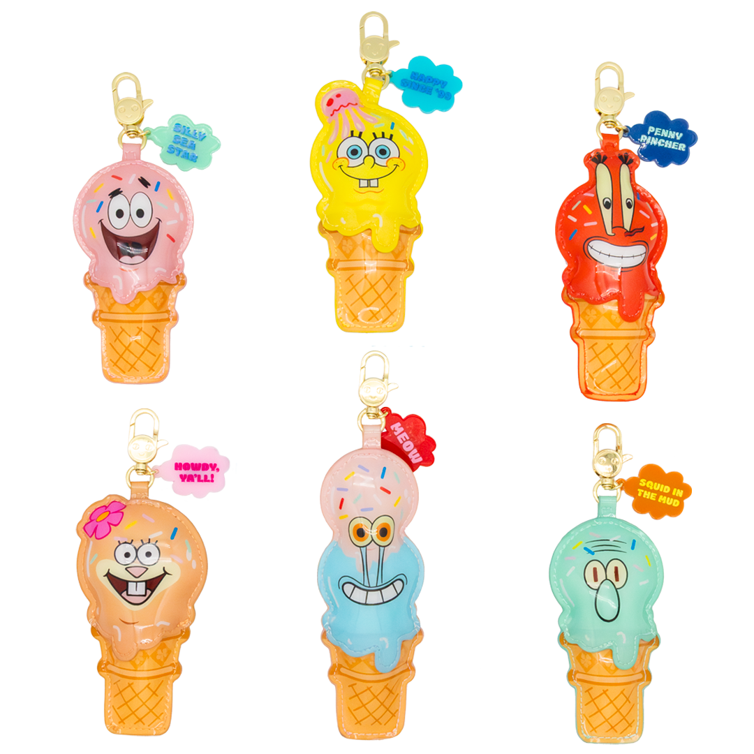 Set of colorful ice cream character bag charms on a white background