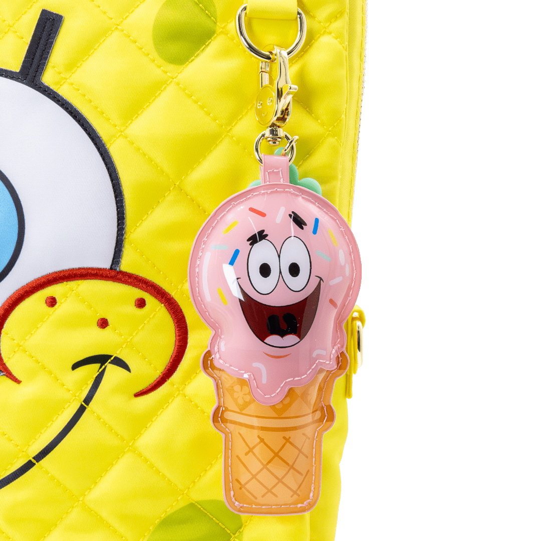 Pink ice cream cone bag charms with a cartoon face on a yellow background