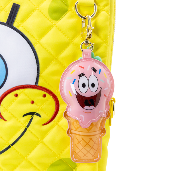 Pink ice cream cone bag charms with a cartoon face on a yellow background