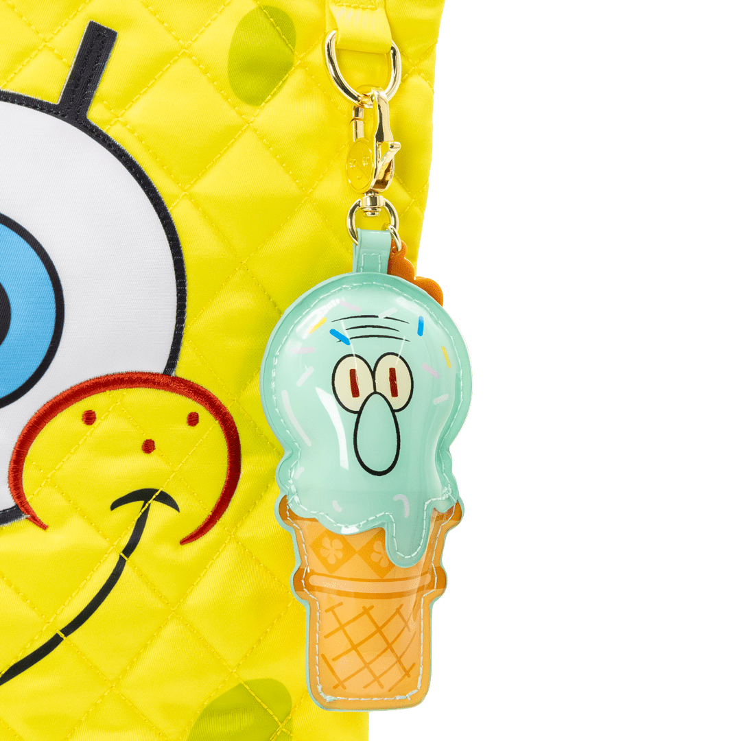 bag charm shaped like a character in an ice cream cone with a yellow character in the background
