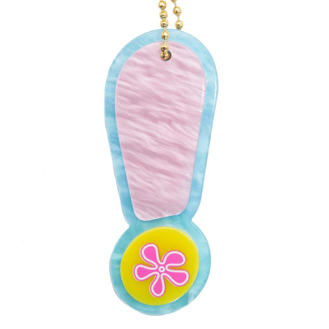 Colorful flip-flop keychain with a pink flower on a white background