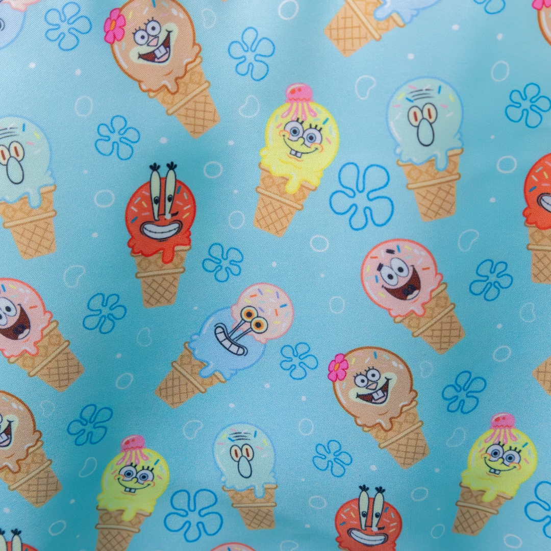 Pattern of cartoon ice cream cones with faces on a blue background