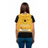 Person wearing a yellow backpack with a bear design and &