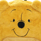 Close-up of a plush bear with a smiling face on a white background