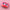 Pink case with cartoon face design on a pink background with confetti