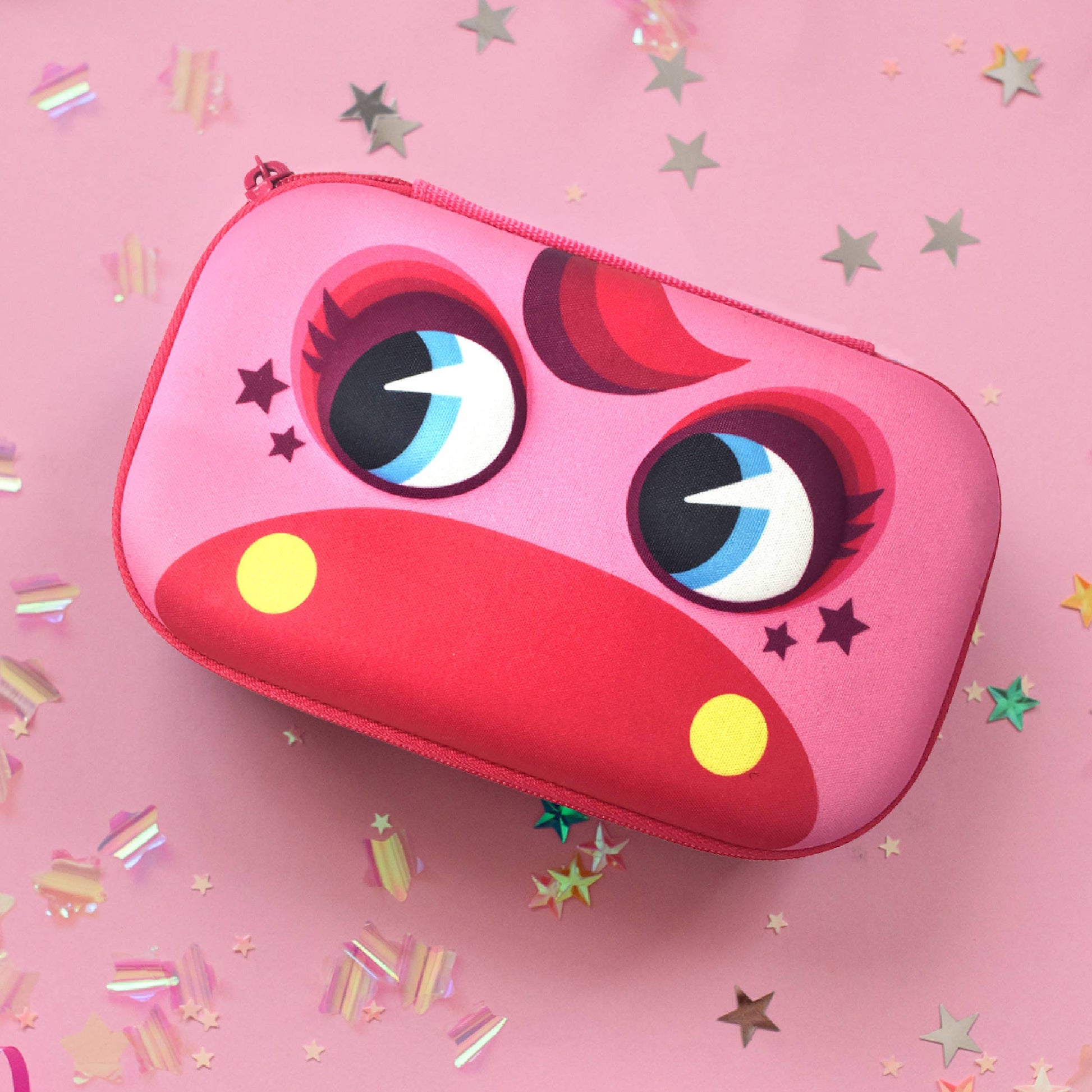 Pink case with cartoon face design on a pink background with confetti