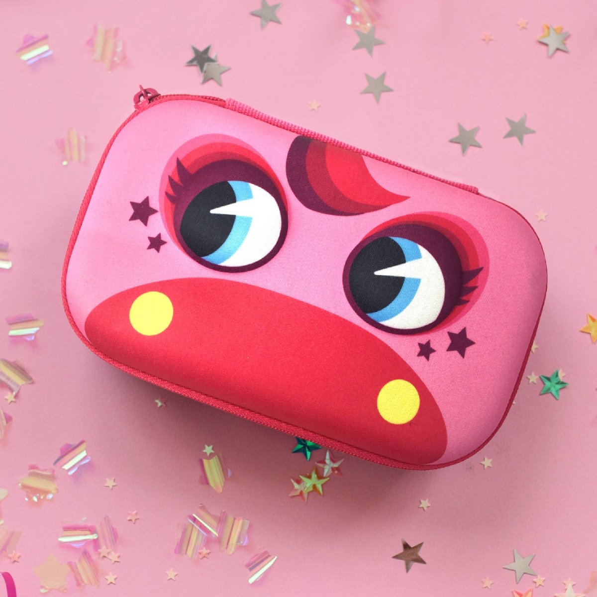 Pink case with cartoon face design on a pink background with confetti