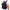 Black backpack with a unique design on the back, worn by a person in a white shirt.
