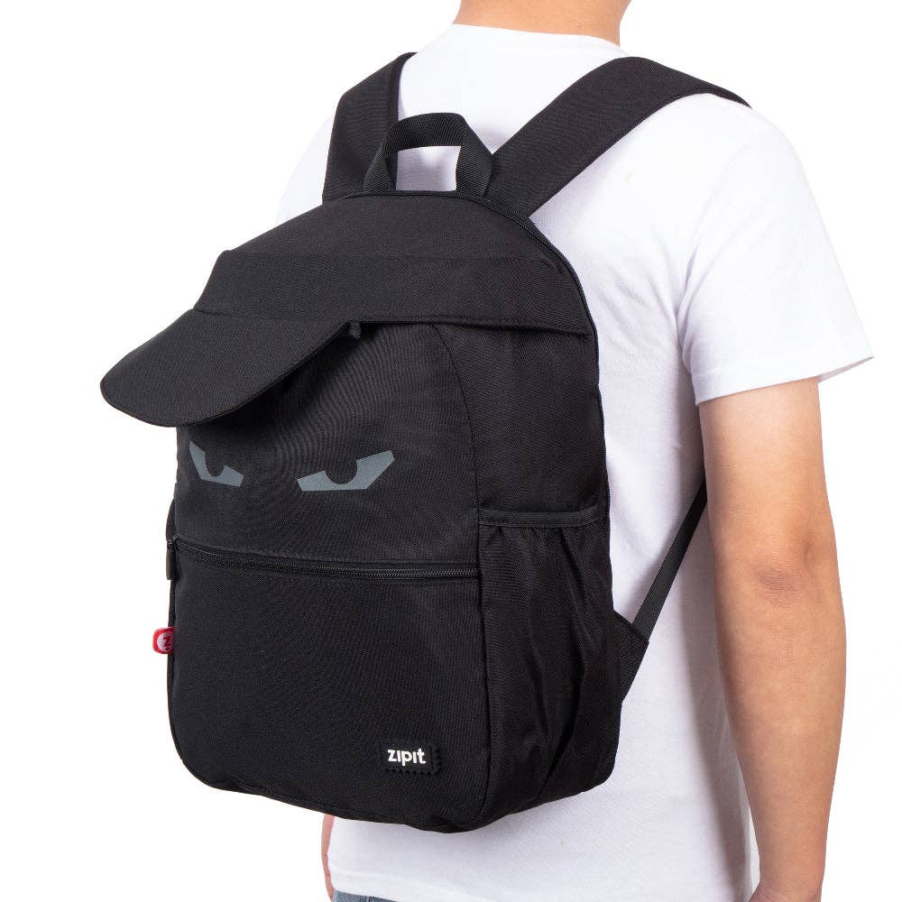 Black backpack with a unique design on the back, worn by a person in a white shirt.