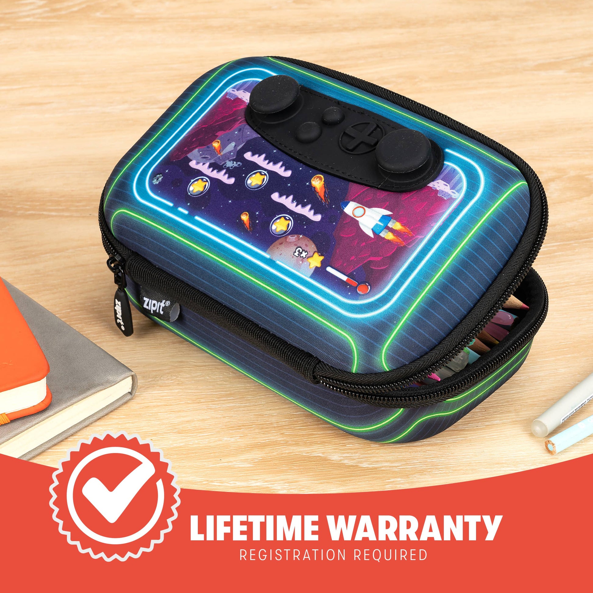 Colorful pencil case with space-themed design on a wooden surface, featuring a lifetime warranty badge.