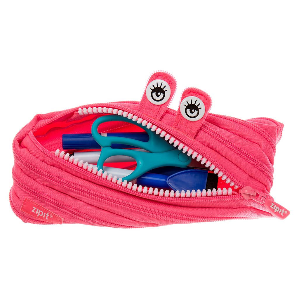 Pink zipper pouch with monster face design containing stationery items on a white background