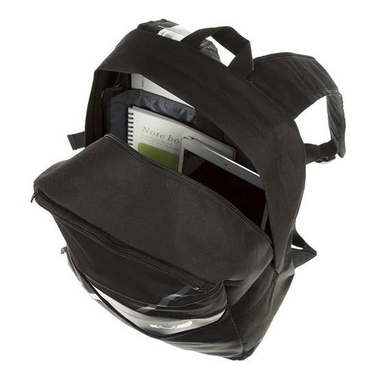 Black backpack with compartments and items inside on a white background