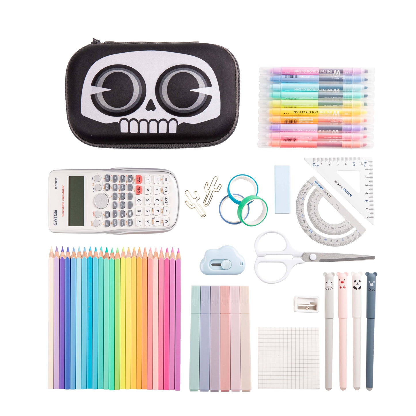 Assorted stationery items including a skull-shaped pencil case, calculators, pens, and other office supplies on a white background.